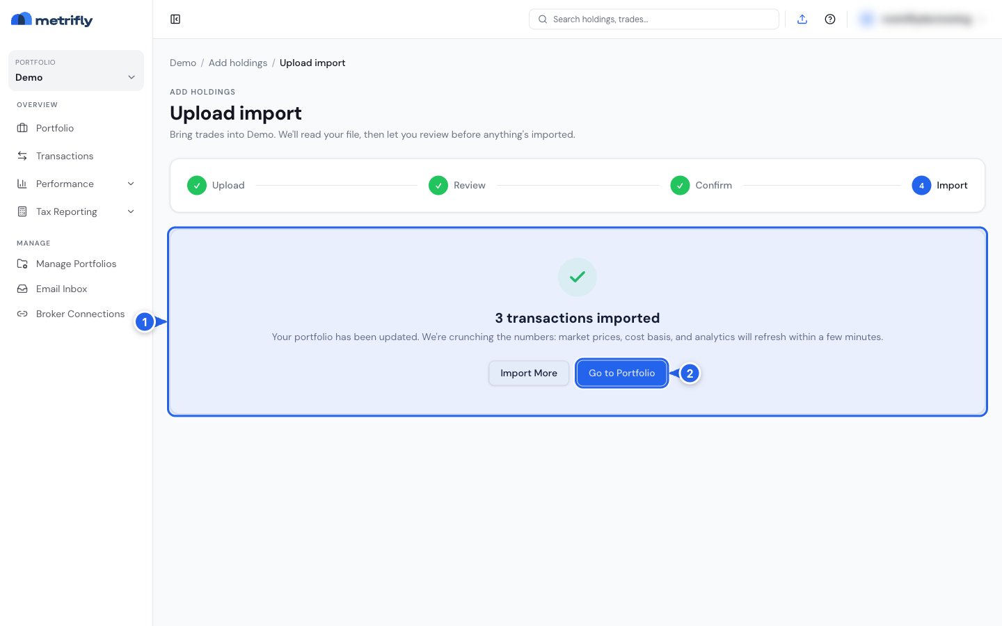 The completed import summary card (1) with the Import More and Go to Portfolio buttons (2)